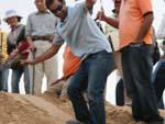 Travis attempts sand-boarding