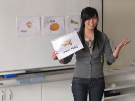 Sonya teaching the class the Mandarin word for ginger.