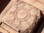 Flower carved in a square stone