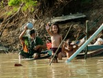Children waving along the Sangker River