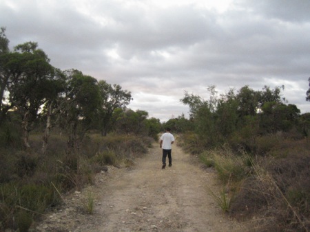 Travis ahead looking for the cache at another site