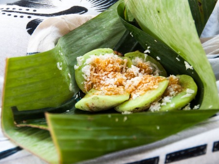 A snack of rice pancake, sugar and coconut