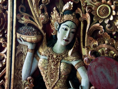 Intricately carved dancing girl on one of the doors