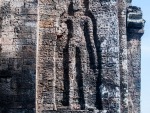 Simple person figure carved into the tower's bricks