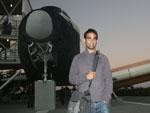 Travis and a retired Space Shuttle