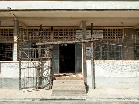 Barbed-wire fence and entrance to Building C at Security Prison 21