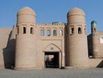 West entrance gate to Khivas Ichon Qala with unfinished Kalta Minor Minaret visible behind