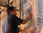 Painters restoring the interior walls of the Sher Dor (Lion) Medressa,