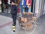Man selling hot sweet potatoes