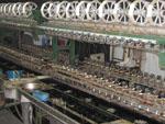 Large machine unwinding the silk threads from silkworm cocoons