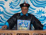Man wearing traditional clothes of a Chinese judge