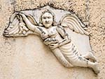 Angel carved in the stone wall