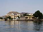 Monsoon Palace on Aravalli Hills in the distance with Lake Pichola Ghats in the foreground