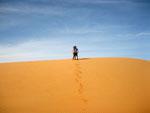 Sonya and Travis on the tip of a sand dune