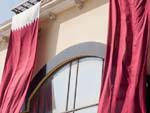Qatar flags draped over a building