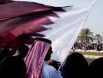 Man waiving Qatar flag