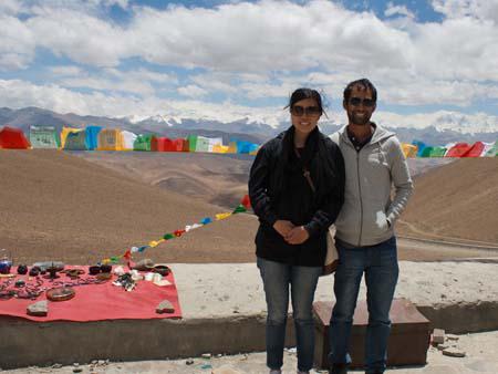 Sonya and Travis at Pang-la pass, the Himalayan Mountains visible in the background