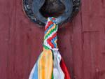 Typical braiding of coloured scarfs found on door rings