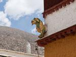 A snow lion on the corner of the Drepung Monastery, commonly seen in Tibet