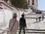 Sonya and the guide Demdul climbing the stairs to the Potala