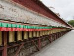 Hundred of prayer wheels around the Potala Palace grounds