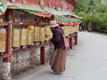 Tibetan spinning prayer wheels outside the Potala Palace