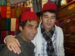 Travis wearing a Fez with the shopkeeper